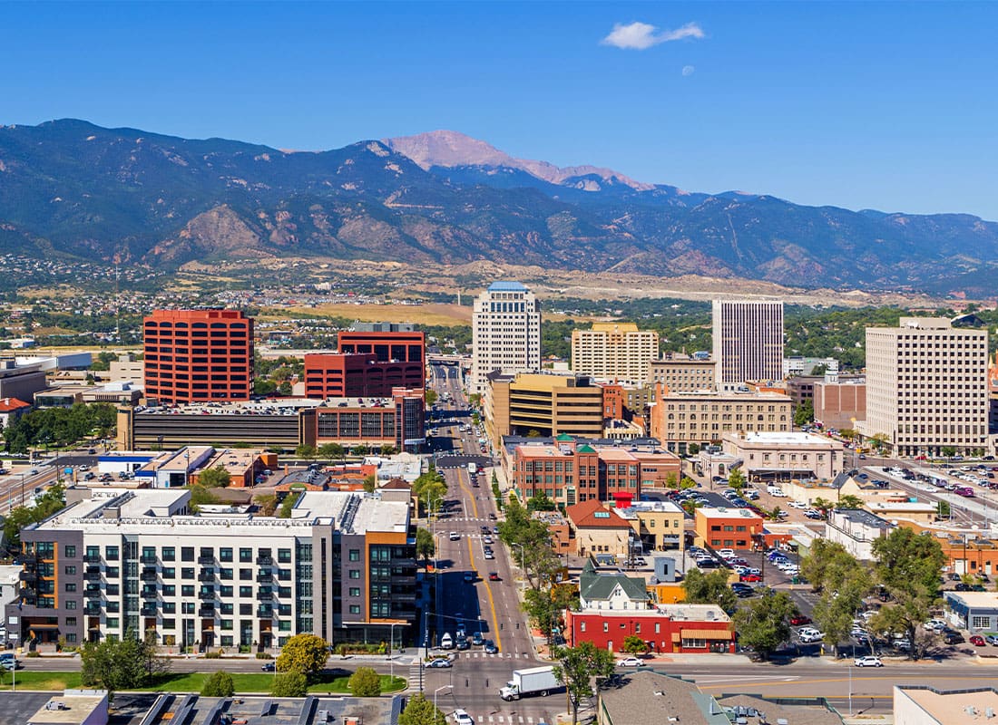 Englewood, CO - Aerial of Downtown Colorado Springs With Pikes Peak in the Background